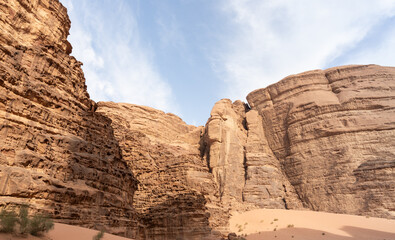 High mountains with abundance of the varied shapes surround the endless desert of the Wadi Rum near...