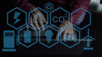 Net zero carbon dioxide reduction concept. CO2 reduction. Hand pressed icon surrounded by renewable...