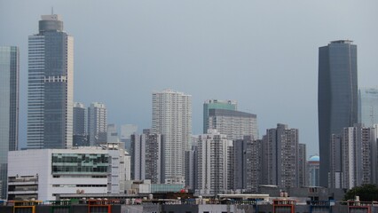 Obraz premium Very tall white buildings in the middle of the city