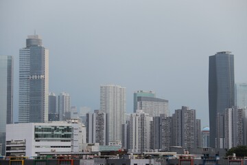 Naklejka premium Very tall white buildings in the middle of the city