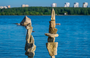 Pyramids of stones in the lake water.