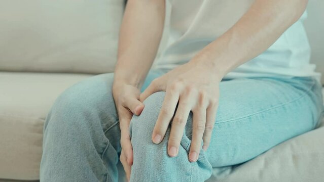 woman having knee ache and muscle pain due to Runners Knee or Patellofemoral Pain Syndrome, osteoarthritis, arthritis, rheumatism and Patellar Tendinitis. medical concept