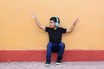 9-year-old dark-skinned Latino boy uses hearing aids that alter learning, memory and retention...