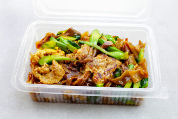 Stir-fried rice noodles with soy sauce and pork