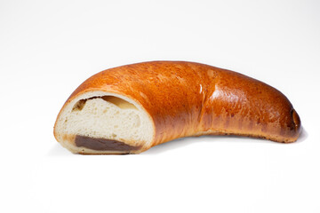 Horn with jam in section on a white background. Horn bun from Berdyansk bakery