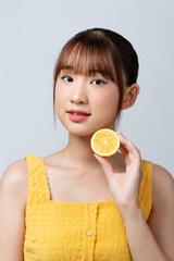 Woman, skincare portrait and lemon for beauty, health and wellness with vitamin c, happy and smile