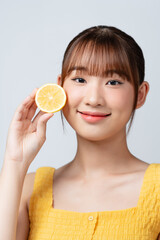 Model, fruit and happiness for self care, clean radiant glow and skin by white background