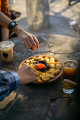 hands of the person take platter