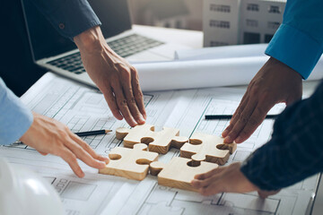 Engineer Teamwork Concept, Worker team hands join puzzle pieces in the office. Joining for cooperation success business of engineering partnership agreement of Architect engineer contractor. teamwork.