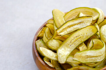 Banana chips, fried slices banana with green peel