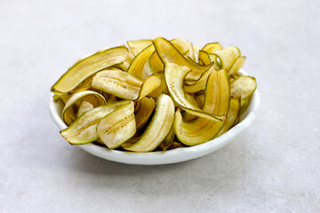 Banana chips, fried slices banana with green peel
