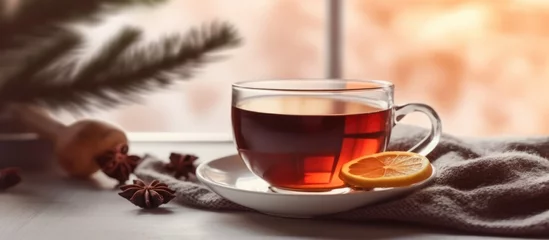 Kussenhoes cup of hot tea on blur winter background © Muhammad