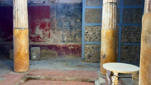 Old preserved royal house with painted walls in Pompeii