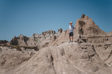 Young boy exploring the rock formations of Badlands National Park