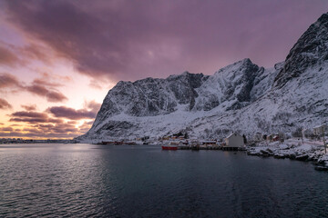 norway lofoten islands winter season snow covered landscapes beaches cloudy sky and colorful houses