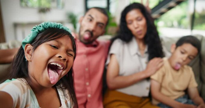 Child, face and funny selfie with happy family for love, together and tongue out in living room on weekend. Parents, kids and portrait with smile to relax for bonding and vacation in house with care