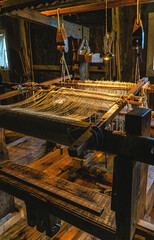old loom for making cloth from cotton threads.