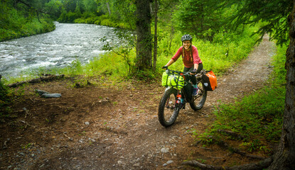 mountain biking bikepacking in the Alaska forest