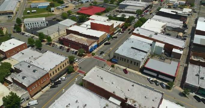 Southern architecture and Main street traffic in Tifton GA. Small town America downtown with narrow driveways and flat roof buildings