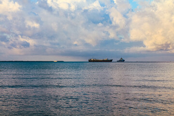 Obraz premium Sea landscape with large steamers or merchant ships on the horizon,Sanya,Hainan Province,China.