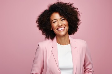 Portrait of smiling african american businesswoman in pink suit