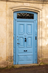 Fototapeta na wymiar Blue French door wooden traditional european entrance to a private house in the City Center