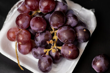 fresh grapes in isolated black background