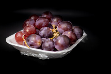 fresh grapes in isolated black background