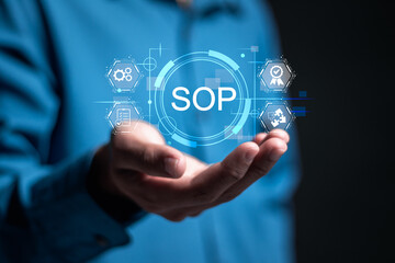 SOP, Standard Operating Procedure concept. Businessman holding virtual SOP icon for standard...