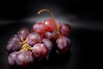 fresh grapes in isolated black background