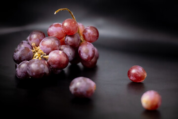 fresh grapes in isolated black background