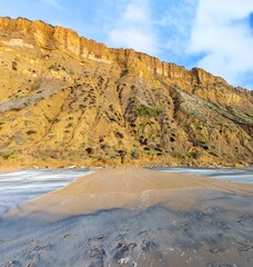 Mud River Flowing Down Sandstone Cliffs at Torrey Pines California State Park after Historic Atmospheric Rain Storm Floods in San Diego, Southern California, USA