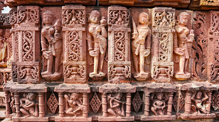 Carved sculptures of women and musicians the Shiva temple, Peenjana, Baran, Rajasthan, India.
