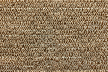 Background, photo of the texture of a self-adhesive, cohesive bandage. Close-up, yellow medical material.