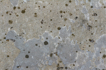 Concrete surface with multi colored round stains.