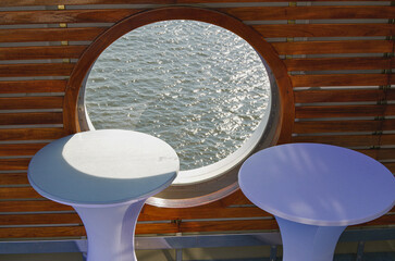 Cocktail tabels on outdoor deck onboard luxury cruiseship cruise ship yacht liner