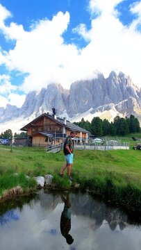 young men at Geisleralm Rifugio Odle Dolomites Italy, a woman hiking in the mountains of Val Di Funes in Italian Dolomites Adolf Munkel Trail in Puez Odle Nature Park