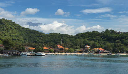 Fototapeta premium Padang Bai bay, green hills and turquoise water on a tropical Bali island