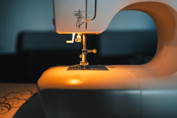 detail of sewing machine on with work light