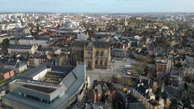 Basilica Saint-Aubin in Place Sainte Anne square and Jacobins convent, Rennes in France. Aerial backward and cityscape