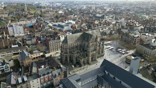 Basilica Saint-Aubin and Notre-Dame de Bonne Nouvelle in Place Sainte Anne square, Rennes in France. Aerial orbiting and cityscape