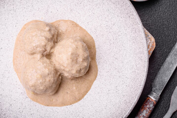 Delicious meatballs from minced chicken or turkey with sour cream sauce