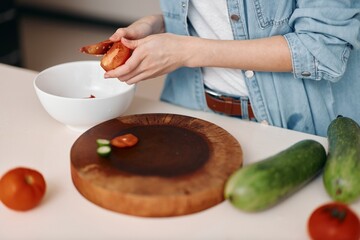 Delicious Temptations: A Female Chef Creating Tasty Homemade Strawberry Cake in a Restaurant Kitchen