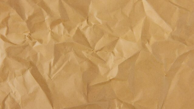 Stop motion of brown crumpled paper texture background	
