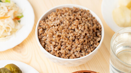 A dish of healthy cereals - buckwheat porridge in a clay bowl, Selective focus