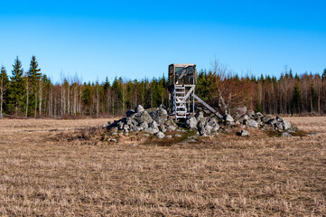 Hunting tower standing on pile of stones