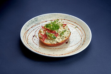 Toast with cream cheese and greens in a plate