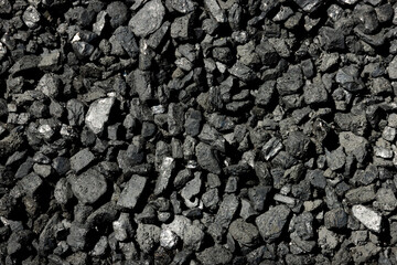 Black mineral coal, brown coal, minerals, stone background. Black coal texture. Copy space.