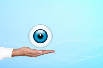 Realistic human eye with blue cornea in the form of a round icon on the palm of a doctor, woman....