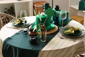 Festive table serving with leprechaun's hat and decorations for St. Patrick's Day celebration